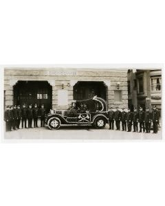 Fire fighters of Engine Co. No. 28, with car decorated with flowers for parade, Los Angeles